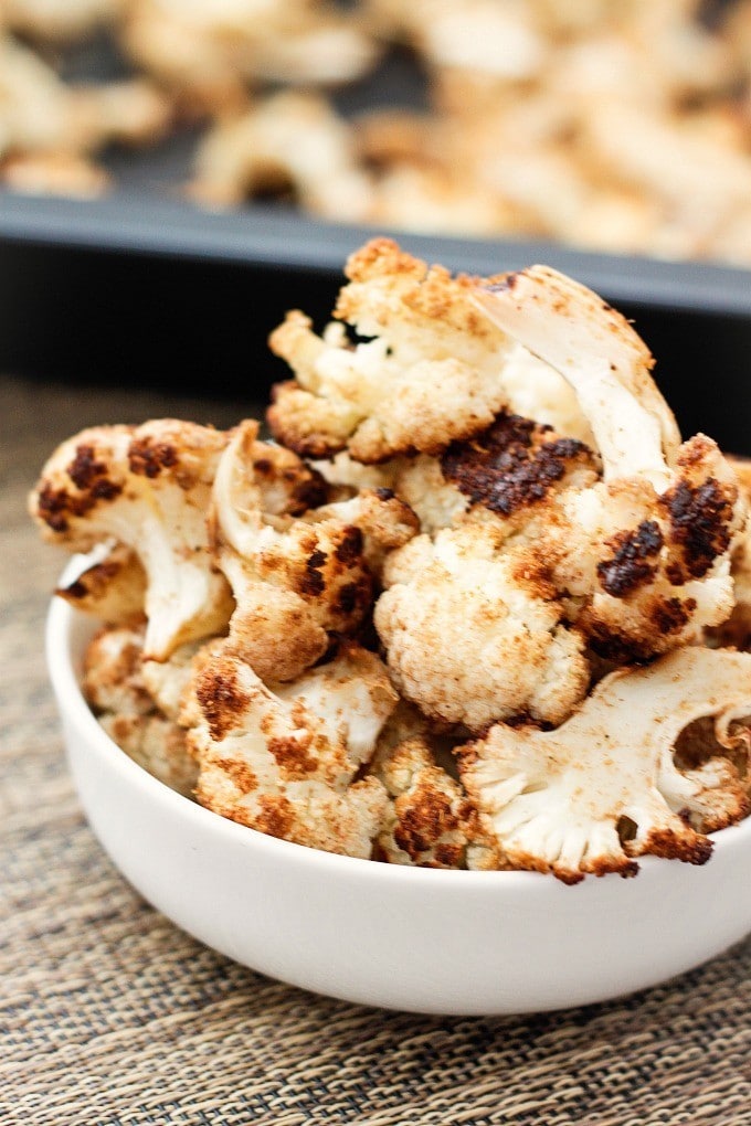 The BEST (and healthy!) Roasted Curried Cauliflower Ever- You'll never make it any other way again! {Vegan, gluten free, paleo recipe}- thebigmansworld.com