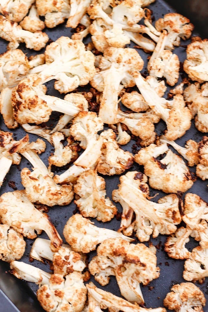 The BEST (and healthy!) Roasted Curried Cauliflower Ever- You'll never make it any other way again! {Vegan, gluten free, paleo recipe}- thebigmansworld.com