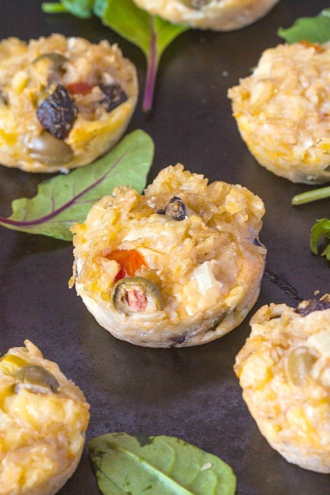 Healthy Brown Rice Pizza Muffins- These portable, easy and delicious muffins taste like pizza! Flourless, #glutenfree and high protein, these muffins are the perfect breakfast, meal or snack choice! -thebigmansworld.com @thebigmansworld.com
