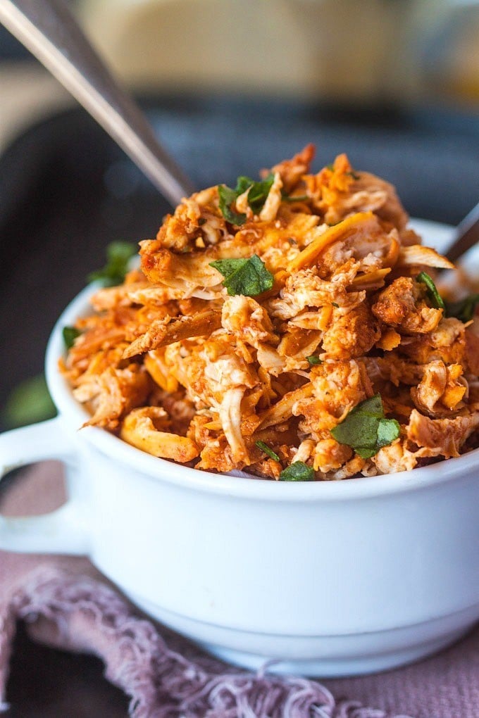 Stovetop Pulled Tandoori Chicken- Moist, flavourful and juicy pulled chicken made over the stovetop and ready in 20 MINUTES- No need for a slow cooker! Paleo, Gluten Free, Dairy Free and Whole30 friendly! @thebigmansworld.com - thebigmansworld.com