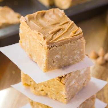 Healthy {No Bake} Triple Peanut Butter Bars- These healthy no bake triple peanut butter bars are the perfect treat or dessert for any peanut butter lover out there- This recipe comes with two versions, both gluten free and one is vegan- Quick, easy and ready in under 20 minutes! @thebigmansworld - thebigmansworld.com