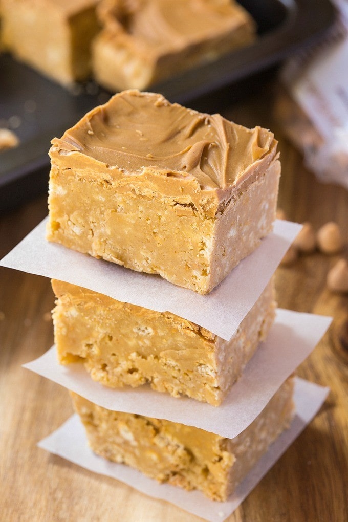 Healthy {No Bake} Triple Peanut Butter Bars- These healthy no bake triple peanut butter bars are the perfect treat or dessert for any peanut butter lover out there- This recipe comes with two versions, both gluten free and one is vegan- Quick, easy and ready in under 20 minutes! @thebigmansworld - thebigmansworld.com