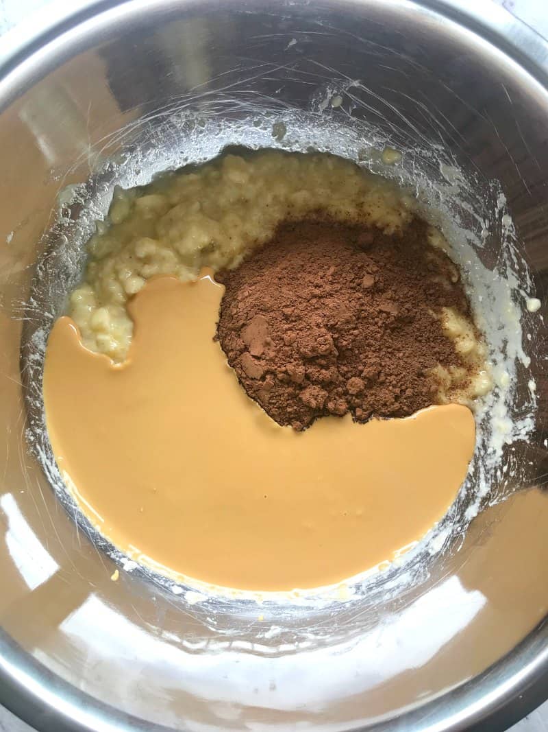 banana, peanut butter and cocoa powder in a mixing bowl.