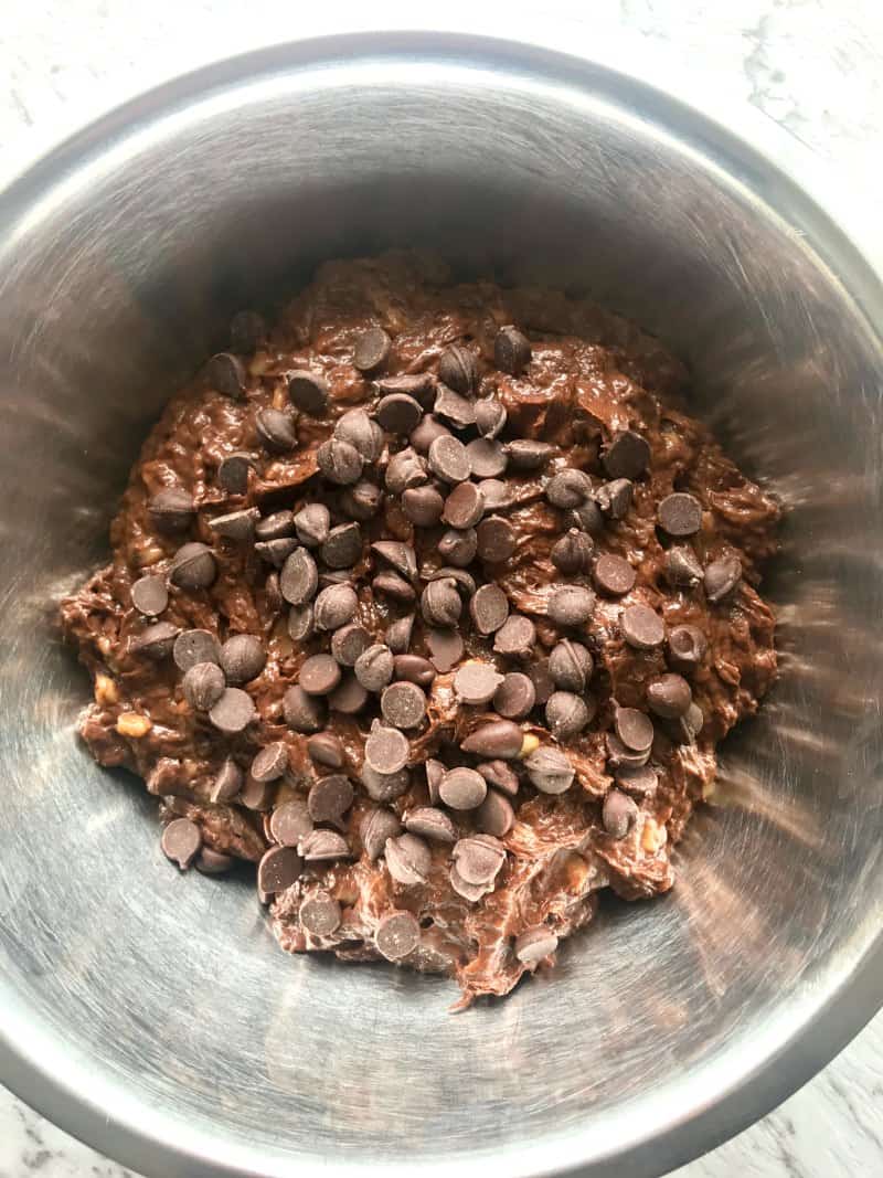 mixing bowl with brownie batter and chocolate chips