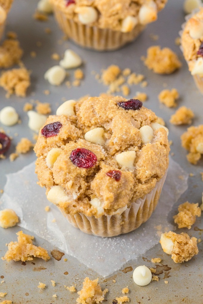 Moist, light and fluffy on the inside, you won't believe these flourless white chocolate cranberry muffins have NO butter, oil, eggs or refined sugar in them! {vegan, gluten free recipe}