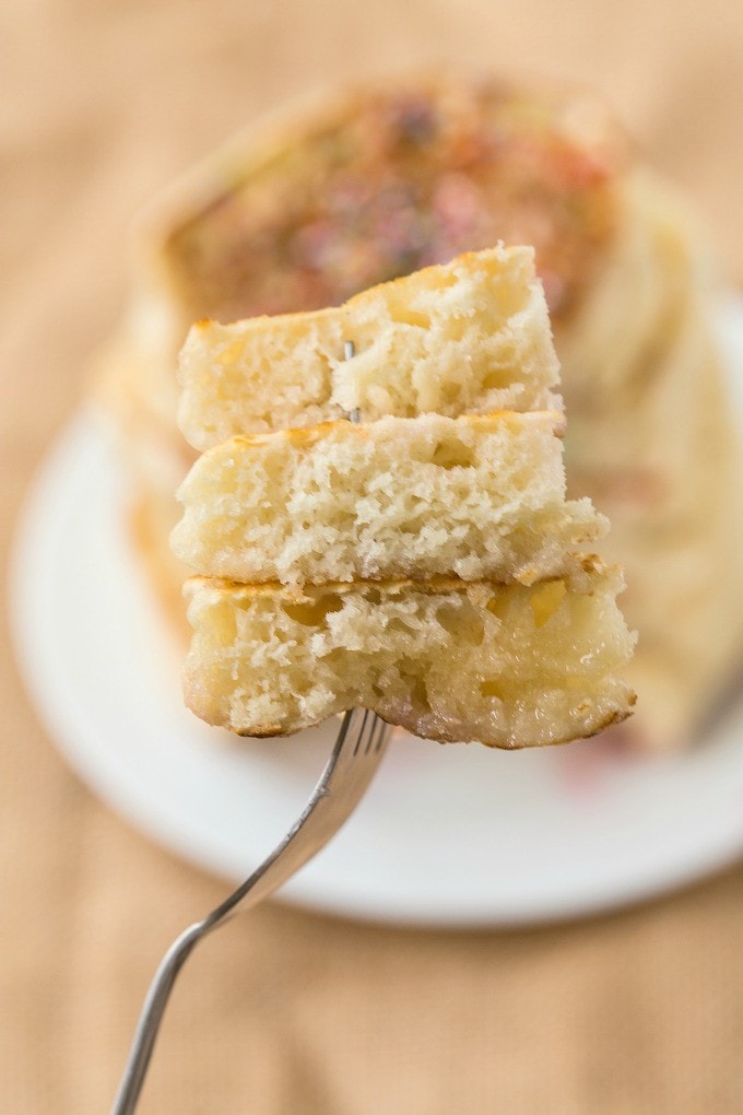 cut up pancakes on a fork. 