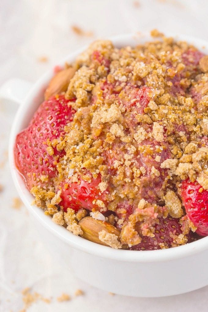 Healthy Fresh Strawberry Breakfast Crumble which can totally pass as dessert too- NO butter, oil, grains, white flour or sugar yet 100% delicious- SO EASY! {vegan, gluten free, paleo recipe}- thebigmansworld.com