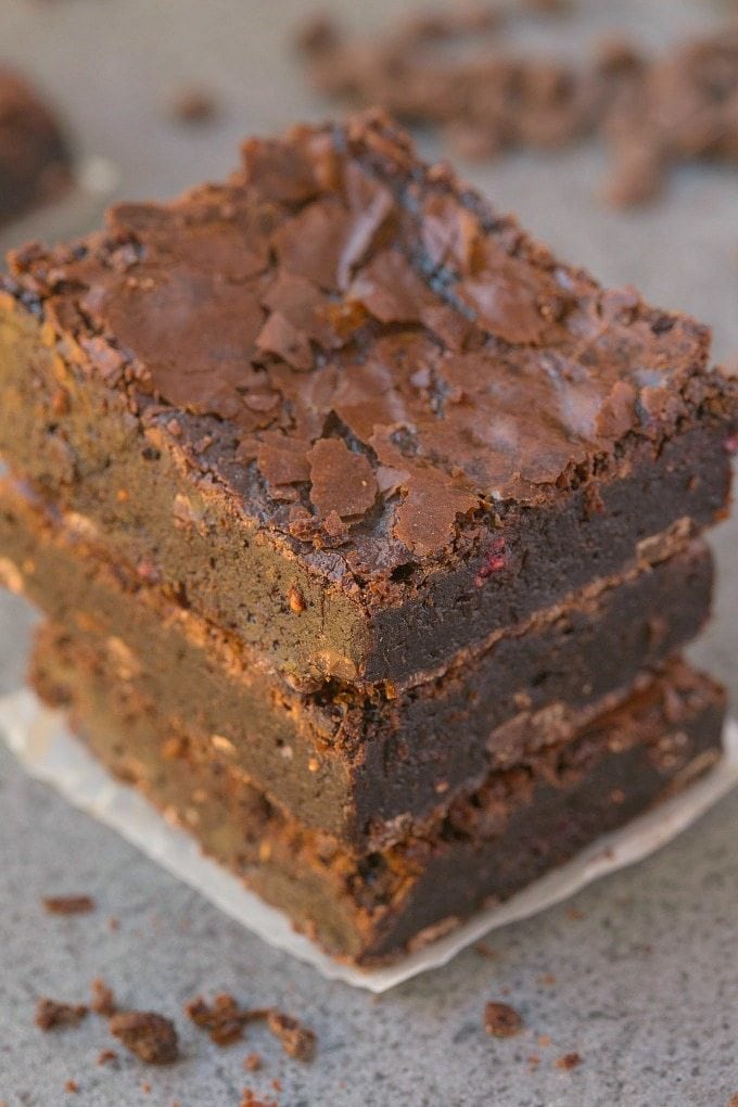 Healthier Flourless Chocolate Raspberry Brownies made with NO flour and NO butter and BETTER than boxed mixes- Fudgy, moist, gooey and with those gorgeous crinkled tops! {vegan, gluten free, paleo recipe}- thebigmansworld.com 