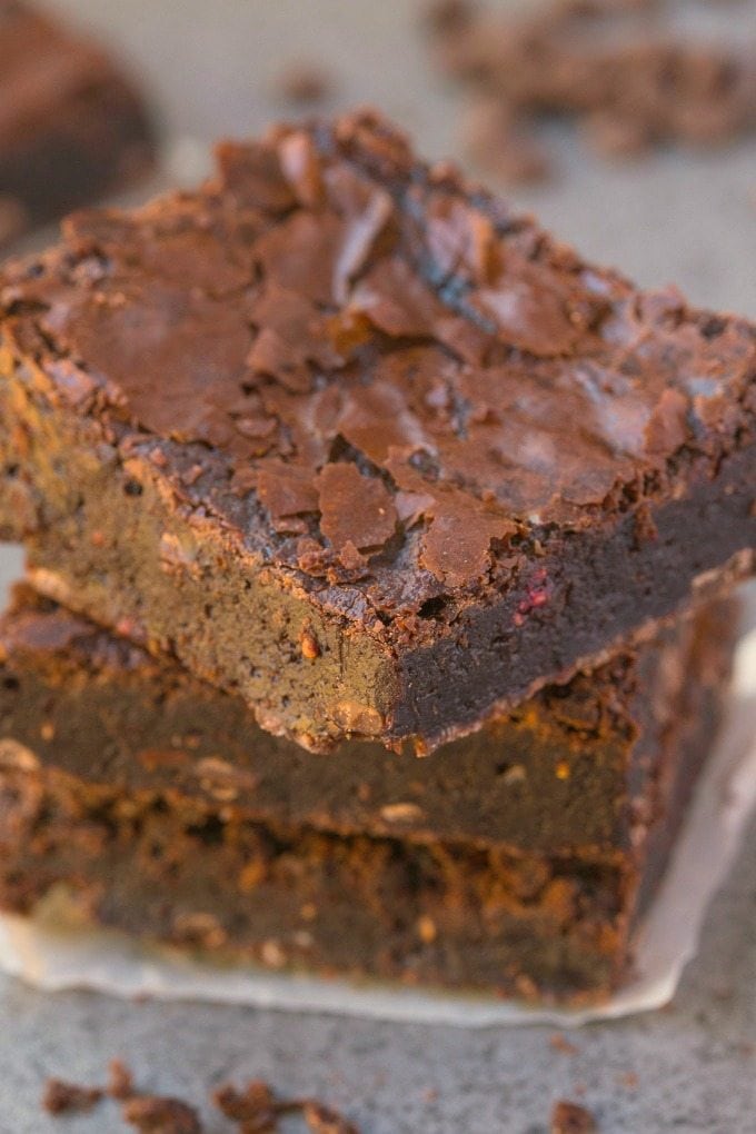 Healthier Flourless Chocolate Raspberry Brownies made with NO flour and NO butter and BETTER than boxed mixes- Fudgy, moist, gooey and with those gorgeous crinkled tops! {vegan, gluten free, paleo recipe}- thebigmansworld.com 