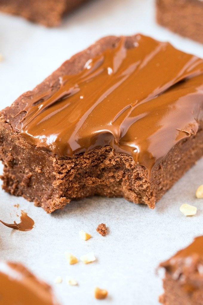 Healthy No Bake "Nutella" BREAKFAST Brownies- Dessert for breakfast! A thick and chewy chocolate brownie base, with a creamy guilt-free frosting packed with protein! Refined sugar free and dairy free! {vegan, gluten free, paleo recipe}- thebigmansworld.com