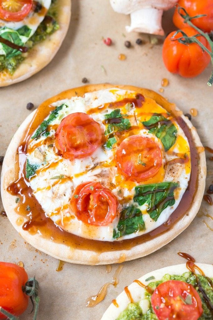 keto Breakfast Pizzas topped with fried egg and tomato