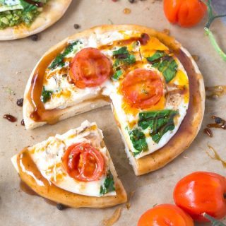 low carb pizza crusts topped with sauce and pesto
