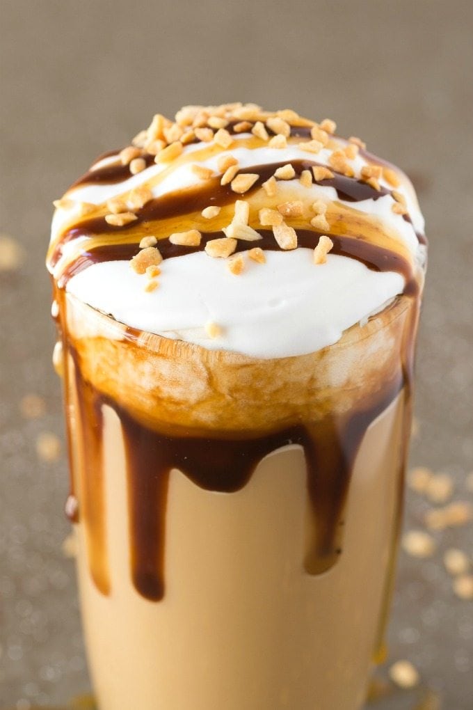 protein shake with whipped cream, chocolate sauce, and crushed peanuts. 