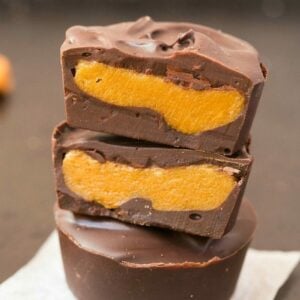 Healthy 4-Ingredient Pumpkin Peanut Butter Cups (V, GF, DF)- Easy, homemade pumpkin peanut butter cups BETTER than Reese's- A creamy fudgy center with a layer of chocolate! {vegan, gluten free, sugar free recipe}- thebigmansworld.com #pumpkin #peanutbutter