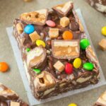 Gluten Free Candy Crunch Bars (Vegan, Dairy Free) is the perfect use of leftover Halloween candy or party chocolate bars and sweets! Customizable, versatile and ready in minutes, this fool-proof no bake bar recipe is the perfect snack or dessert! {v, gf, df recipe}- thebigmansworld.com