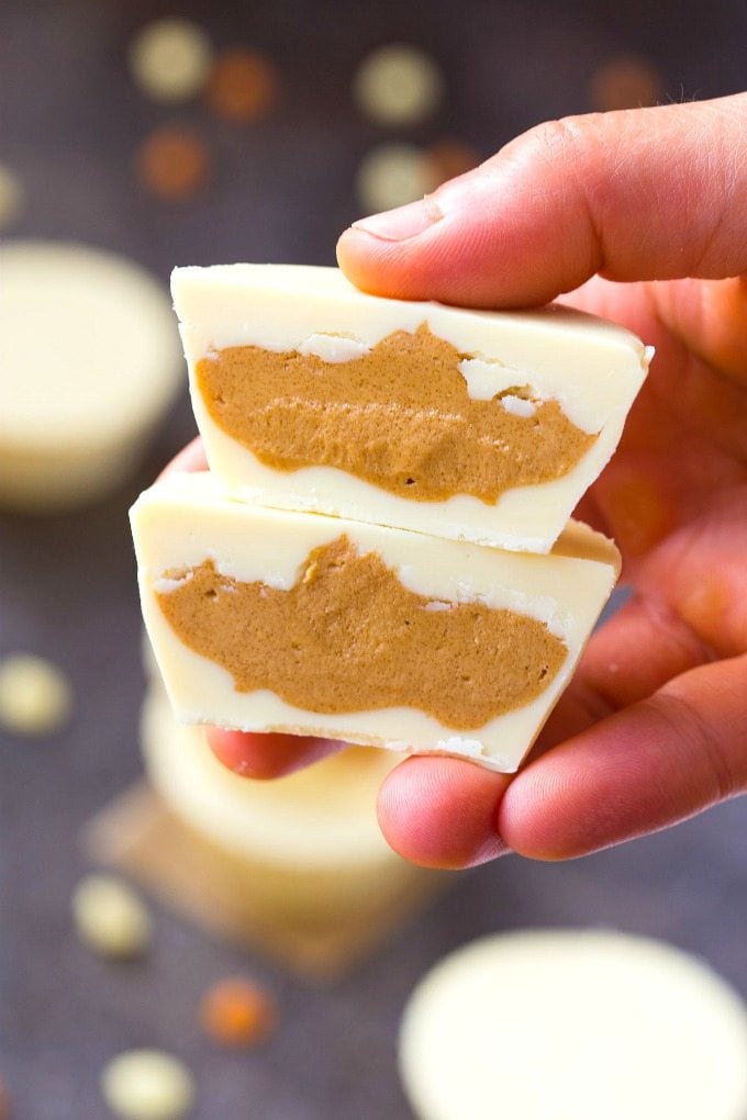 Keto Vegan White Chocolate Peanut Butter Cups- Reese's white chocolate peanut butter cups gets a keto, sugar-free and dairy-free makeover! A creamy, peanut butter filling covered in dairy-free, vegan and keto white chocolate! Nut-Free and Paleo option too! #ketogenic #ketodessert #vegandessert #vegancandy #peanutbutter #homemadecandy