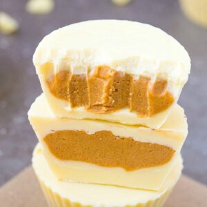 Keto Vegan White Chocolate Peanut Butter Cups- Reese's white chocolate peanut butter cups gets a keto, sugar-free and dairy-free makeover! A creamy, peanut butter filling covered in dairy-free, vegan and keto white chocolate! Nut-Free and Paleo option too! #ketogenic #ketodessert #vegandessert #vegancandy #peanutbutter #homemadecandy