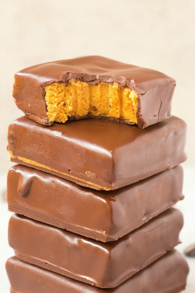 4-Ingredient No Bake Peanut Butter Protein Bars (Paleo, Vegan, Keto, Sugar Free, Gluten Free)- Easy, healthy and low carb bars using just 4 ingredients and needing 5 minutes- They taste like Reese's peanut butter cups and better than store bought! #keto #peanutbutter #chocolate #healthy #nobake | Recipe on thebigmansworld.com
