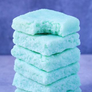 4-Ingredient Blue Matcha Bars (Keto, Paleo, Vegan, Sugar Free, Low Carb)- An easy recipe for mermaid inspired no bake coconut bars 100% Naturally colored- NO food dye! Sugar Free, dairy free and ready in under 5 minutes- the ultimate vegan ketogenic dessert! #ketosisrecipe #ketorecipe #mermaid #bluematcha | Recipe on thebigmansworld.com