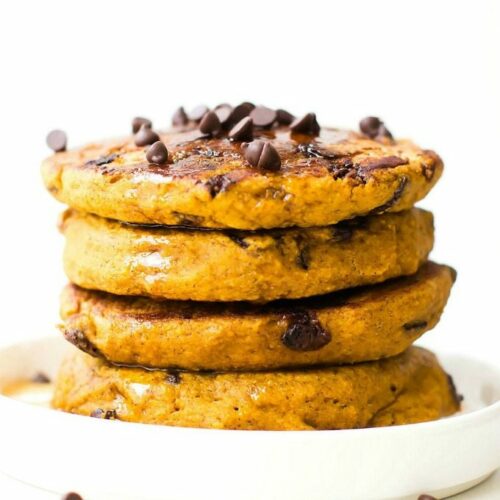 Fluffy Low Carb Keto Chocolate Chip Pancakes topped with chocolate chips