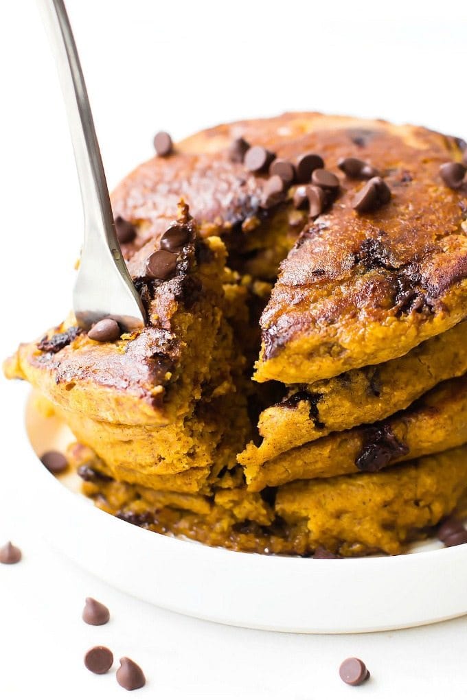 Fluffy Low Carb Keto Chocolate Chip Pancakes (Paleo, Vegan, Sugar Free, Gluten Free)- A quick and easy recipe for Thick, fluffy flourless pancakes with chocolate chips- Easy everyday ingredients, freezer-friendly and a healthy ketogenic breakfast option! #ketopancakes #lowcarbpancakes #veganpancakes #paleopancakes | Recipe on thebigmansworld.com