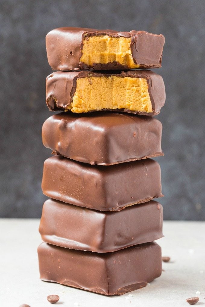 Healthy No Bake Peanut Butter Chocolate Bars stacked on top of one another