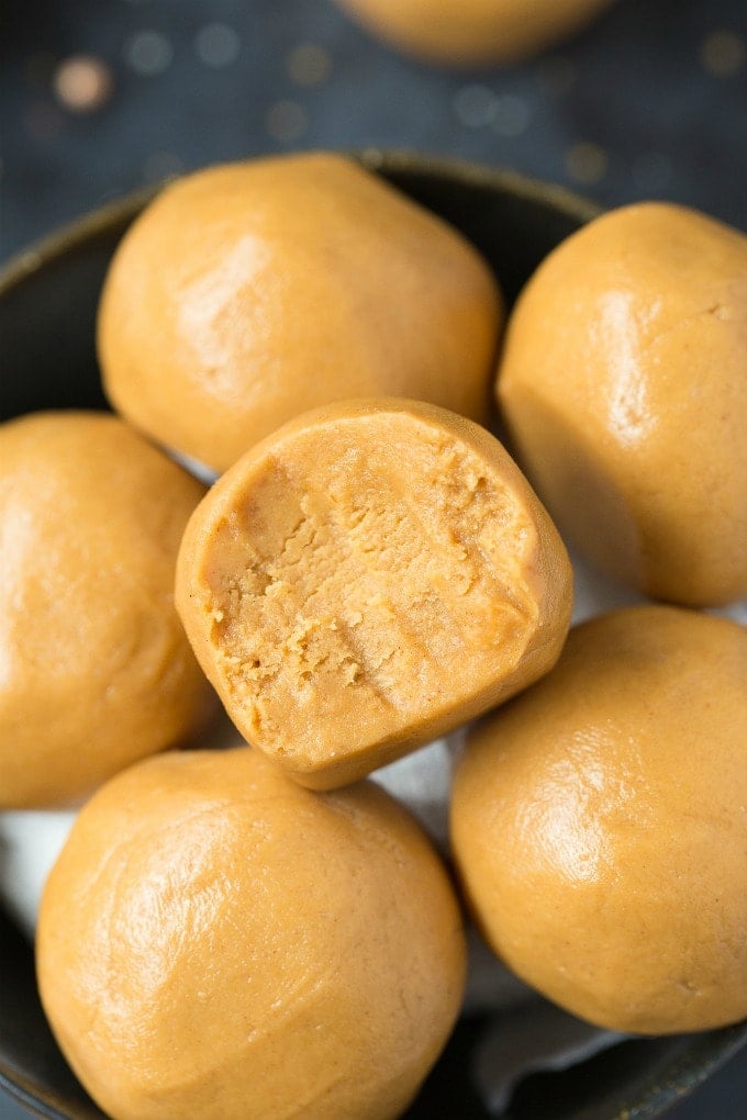 3-Ingredient No Bake Keto Peanut Butter Balls (Paleo, Vegan, Low Carb)- Easy chewy, fudgy no bake peanut butter protein balls recipe ready in 5 minutes and needing 3 ingredients! A quick and easy snack! #peanutbutter #proteinballs #energyballs #ketorecipe | Recipe on thebigmansworld.com