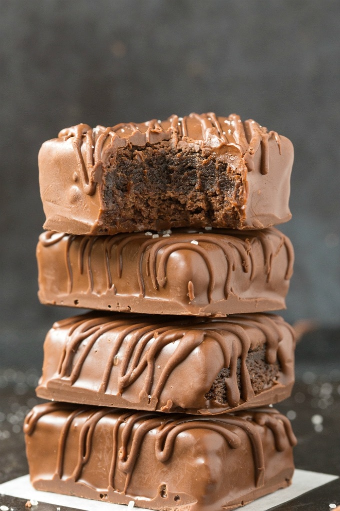 Flourless 4-Ingredient Keto Protein Brownies stacked up covered in chocolate
