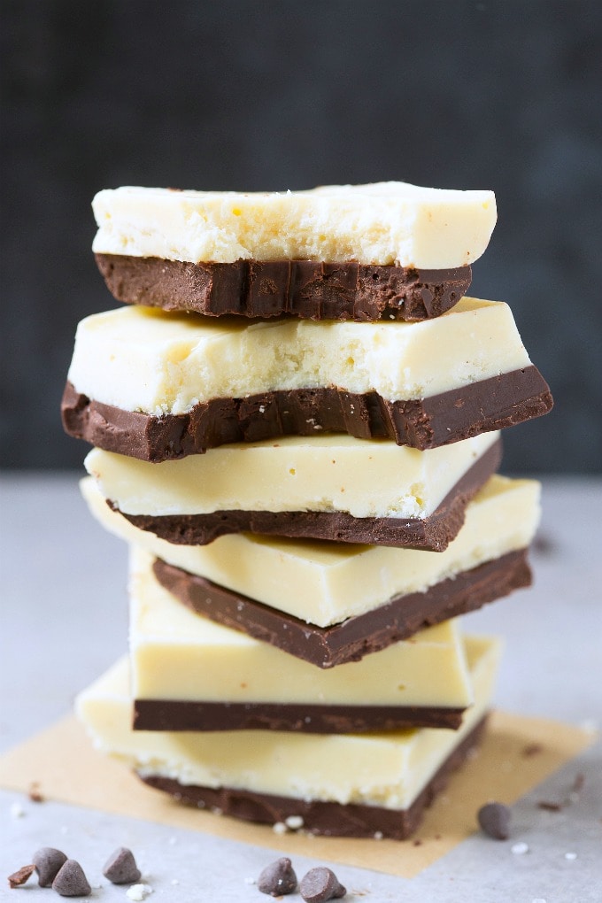 2-Ingredient Low Carb Keto Chocolate Coconut Fat Bombs stacked on top of one another.