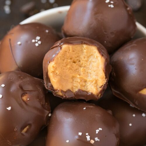 4-Ingredient No Bake Keto Chocolate Peanut Butter Balls (Paleo, Vegan, Low Carb)- An easy healthy no bake chocolate peanut butter protein balls recipe ready in 5 minutes and needing 4 ingredients! A quick and easy snack! #peanutbutter #chocolatepeanutbutter #proteinballs #ketorecipe | Recipe on thebigmansworld.com