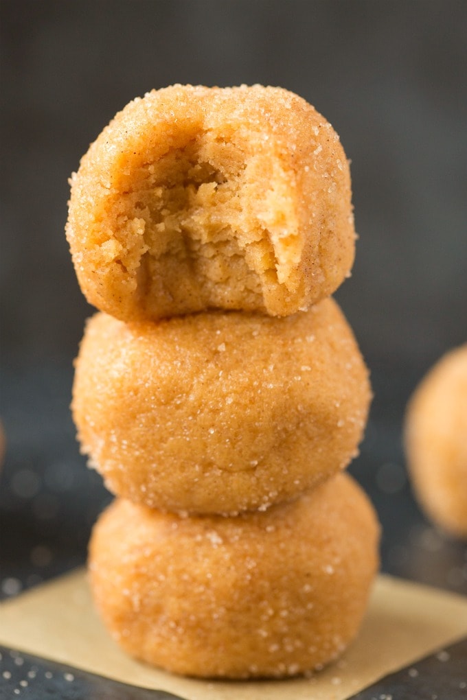 No Bake Pumpkin Spice Latte Energy Bites stacked on top of one another.