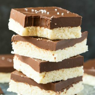 Healthy 4-Ingredient Paleo Vegan Chocolate Coconut Bars (Keto, Low Carb, Sugar Free)- An easy 5-minute recipe for homemade chocolate coconut bars made with no sugar, no dairy and the perfect dessert or snack! #keto #ketogenic #paleo #vegandessert #ketodessert | Recipe on thebigmansworld.com