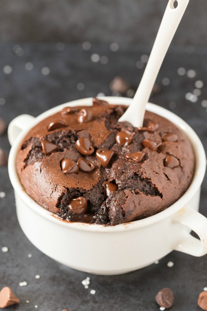 Healthy 1-Minute Flourless Mug Brownie with a white spoon in it