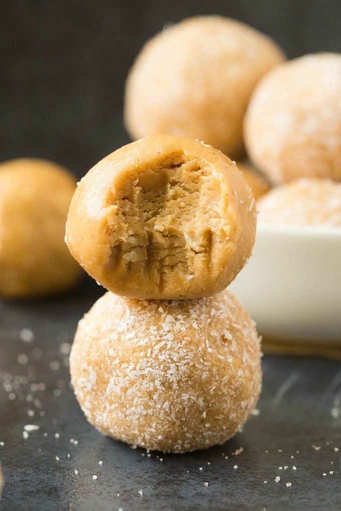 Healthy No Bake Salted Caramel Protein Bliss Balls stacked on top of one another.