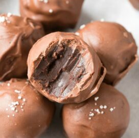 A stack of healthy brownie batter no bake truffles.
