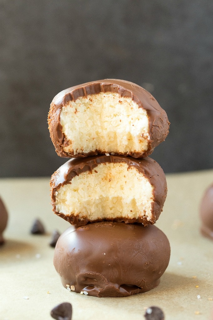 A stack of 4 ingredient no bake chocolate coconut balls. 