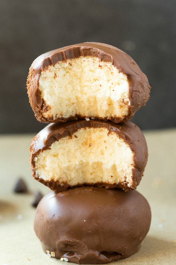 A stack of no bake chocolate coconut balls with interior shots.