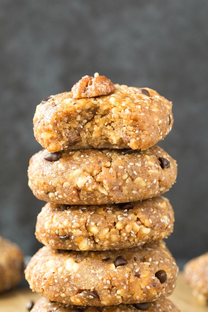 A stack of no bake low carb pecan pie cookies topped with sugar free candied pecans