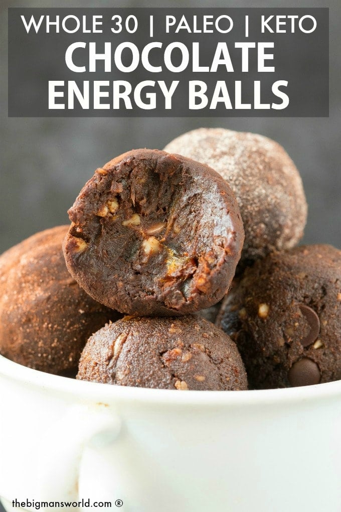 A white bowl filled with paleo whole30 no bake chocolate protein balls, with the one at the front with a bite mark out of it- Text written at the top saying Whole 30, paleo, keto chocolate energy balls. 
