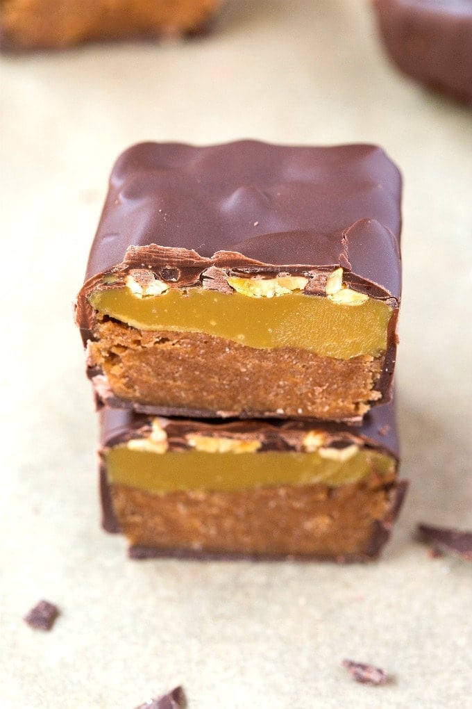 A homemade keto and low carb snickers bar filled with caramel, nougat and covered in chocolate
