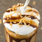 A glass of keto chocolate peanut butter smoothie shake