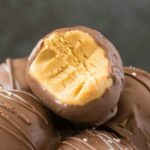 Healthy 4 ingredient chocolate peanut butter truffles in a white bowl