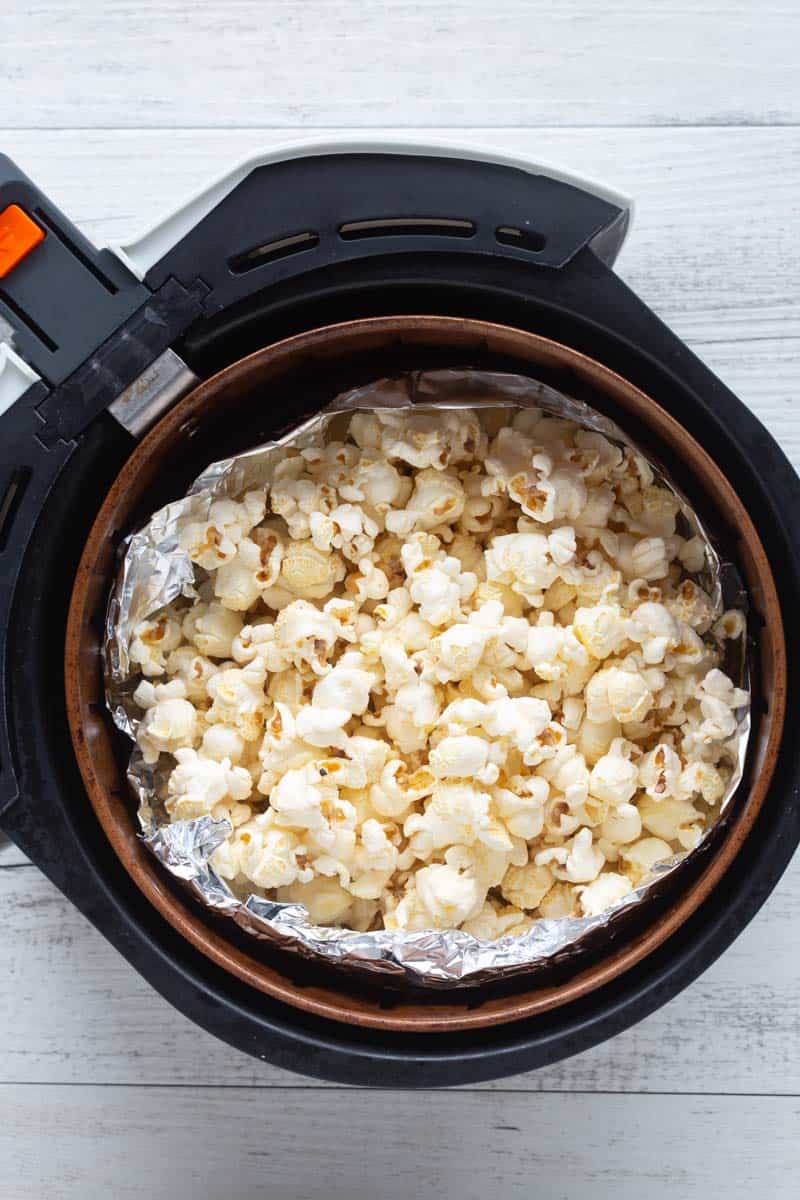 Ingredients to make popcorn, including butter, corn grains