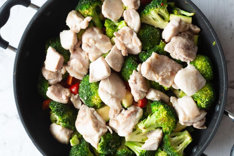 chicken and vegetables in a pan