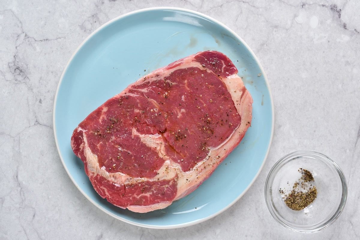 seasoned raw steaks.