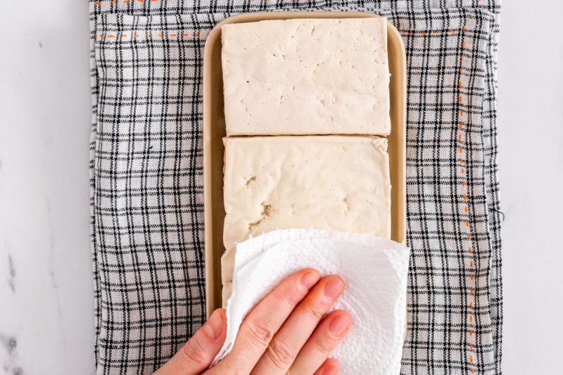 pressing tofu.
