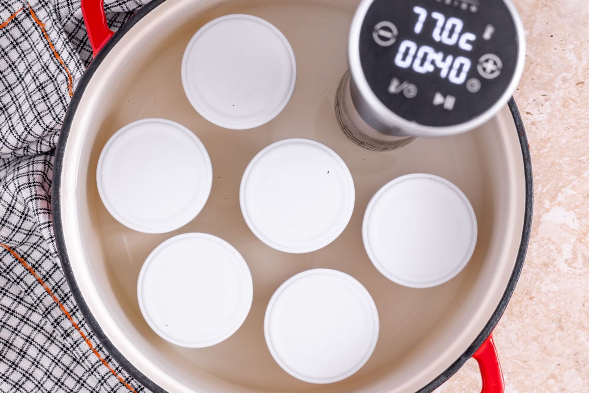 sous vide cooker in pot with eggs.