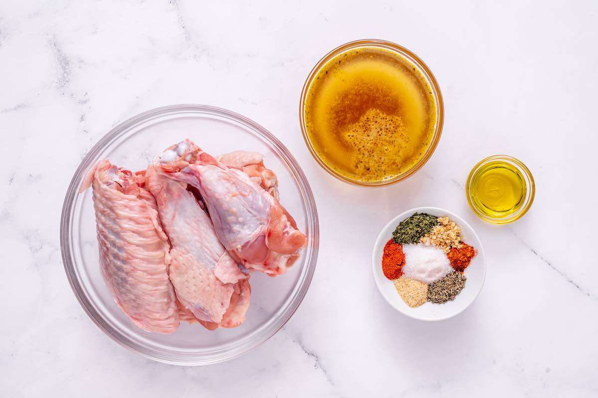 prepped turkey wings and seasonings in a bowl.