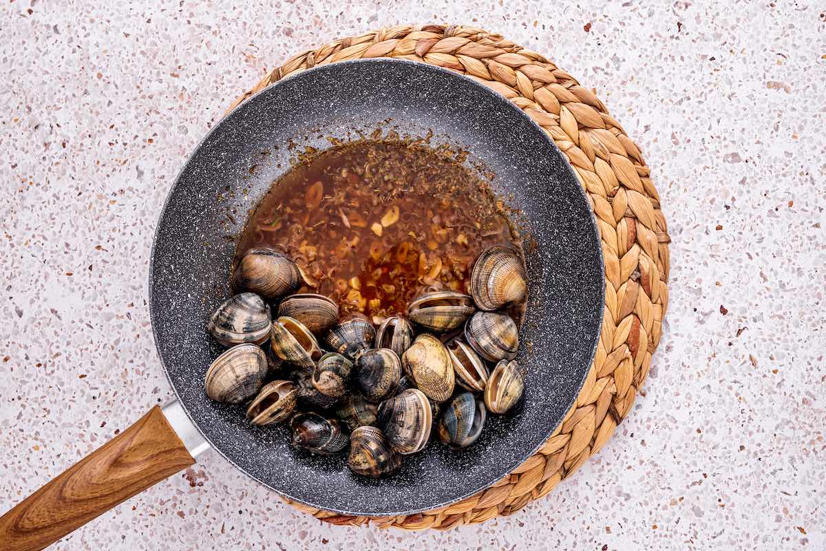 cooking clams with aromatics. 