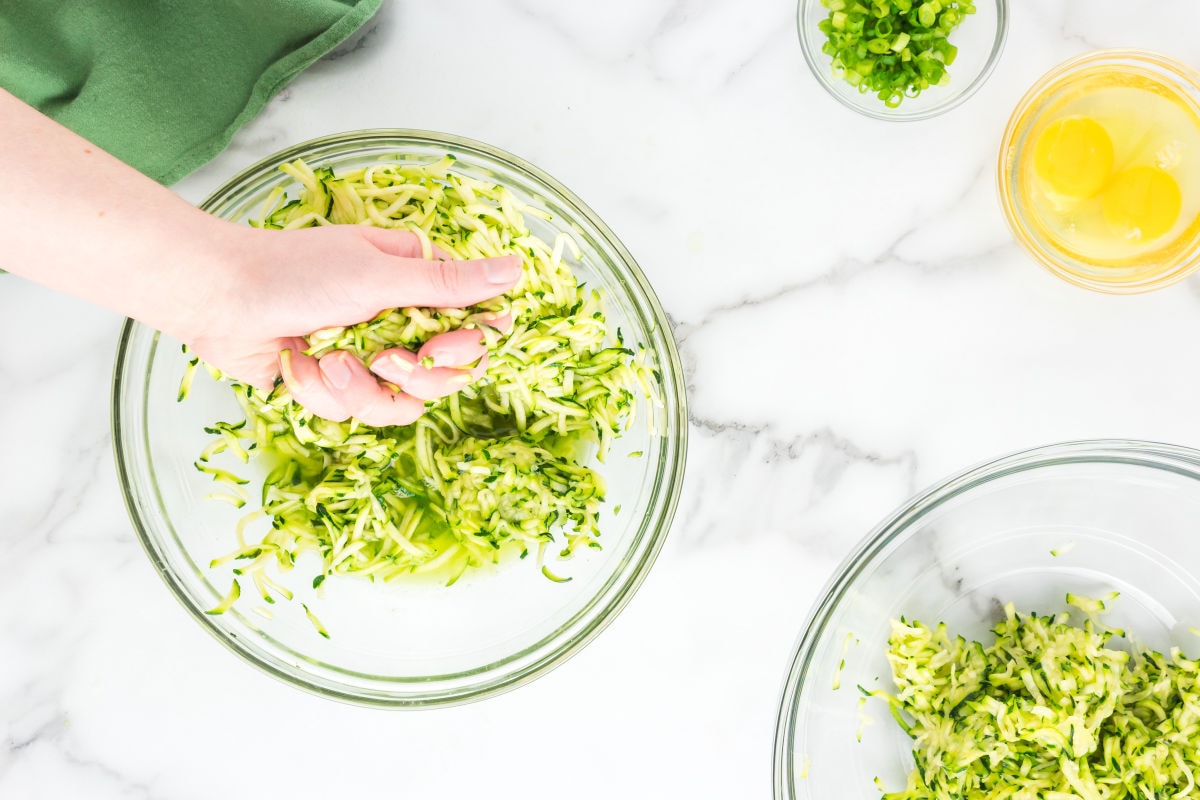 squeezing moisture out of zucchini.